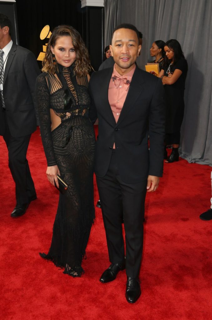 LOS ANGELES, CA - FEBRUARY 12: Model Chrissy Teigen (L) and recording artist John Legend at The 59th Annual GRAMMY Awards at STAPLES Center on February 12, 2017 in Los Angeles, California. (Photo by Joe Scarnici/Getty Images for FIJI Water)