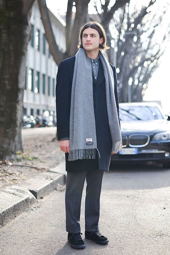 MILAN, ITALY - JANUARY 18: Alberto D'Altorio poses wearing an Our Legacy coat, Acne Studios shirt and scarf and Nike X Comme des Garcons shoes before the Emporio Armani show during the Milan Men's Fashion Week Fall/Winter 2016/17 on January 18, 2016 in Milan, Italy. (Photo by Vanni Bassetti/Getty Images)