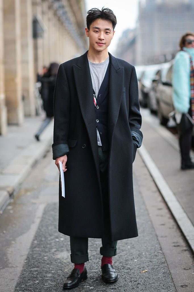 PARIS, FRANCE - JANUARY 24: Dong Goo Kang wearing a Marni coat, a Tom Browne cardigan and Tods shoes after the Rynshu show during Paris Fashion Week Menswear Fall Winter 2016/2017 on January 24, 2016 in Paris, France. (Photo by Edward Berthelot/Getty Images)